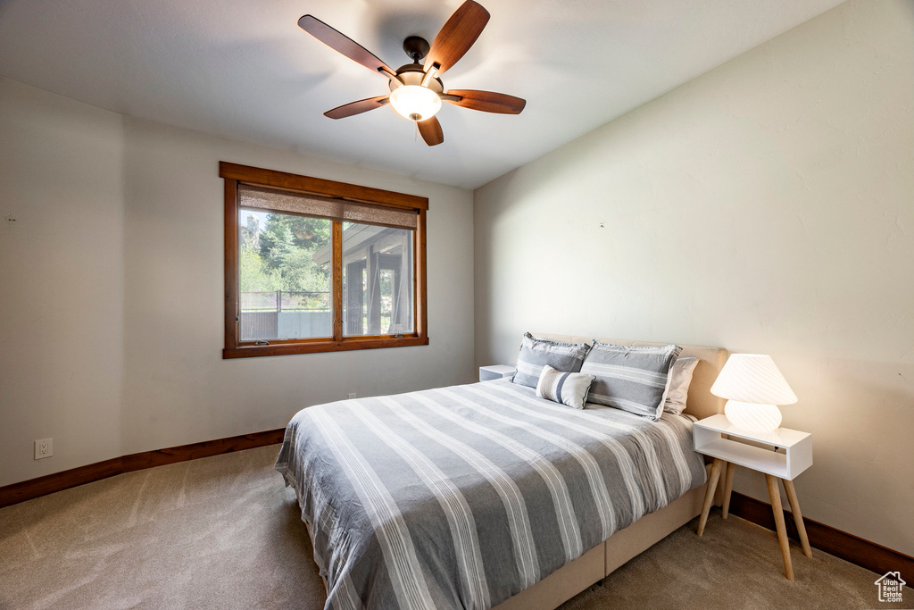 Bedroom featuring carpet flooring and a ceiling fan