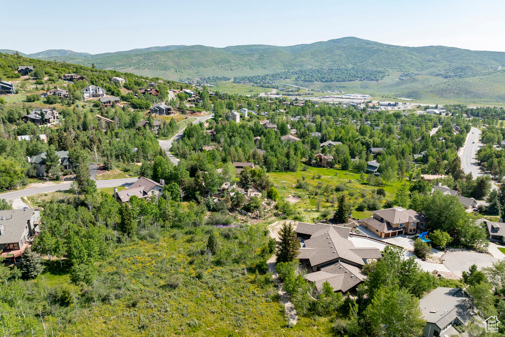 Aerial view of residential area featuring mountains