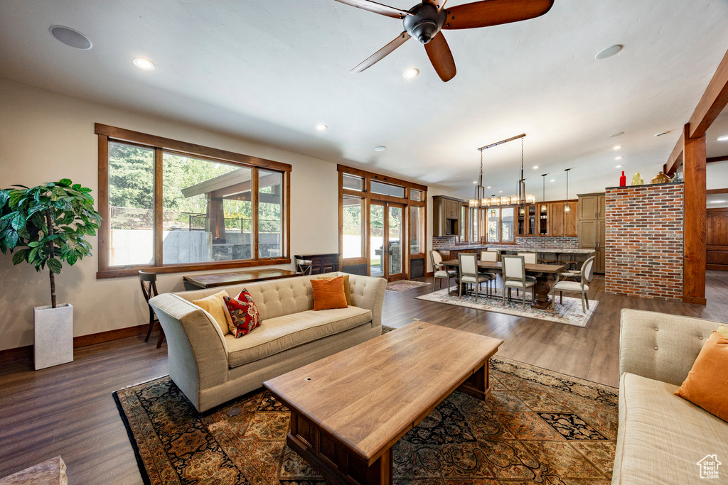Living room featuring dark wood finished floors, recessed lighting, and a ceiling fan