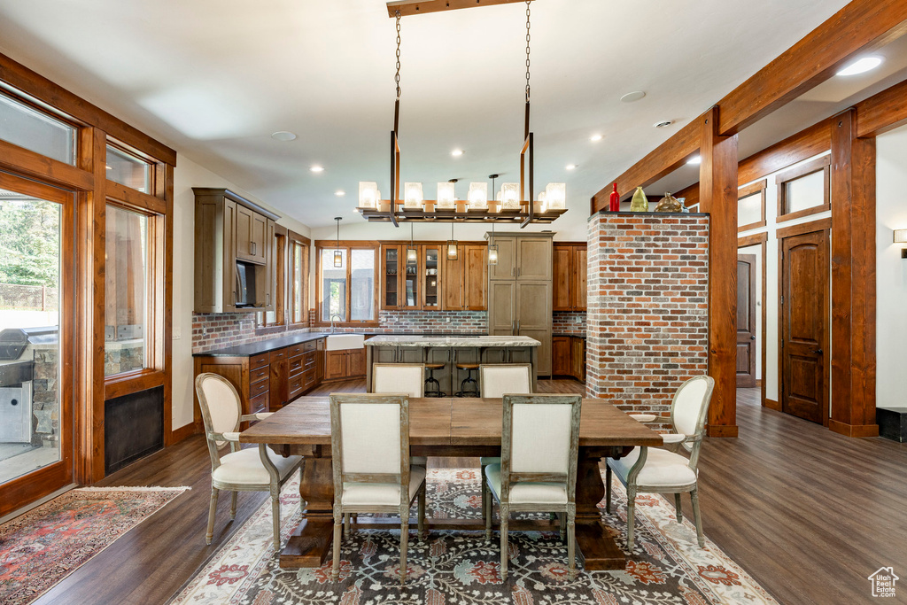 Dining room featuring plenty of natural light, dark wood finished floors, and recessed lighting