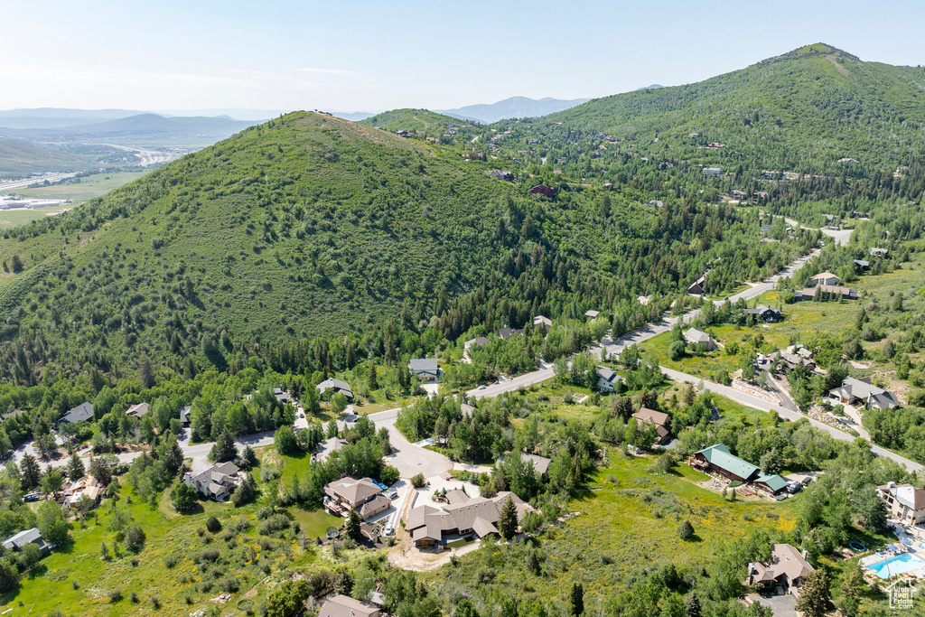Aerial view of property's location with a mountainous background