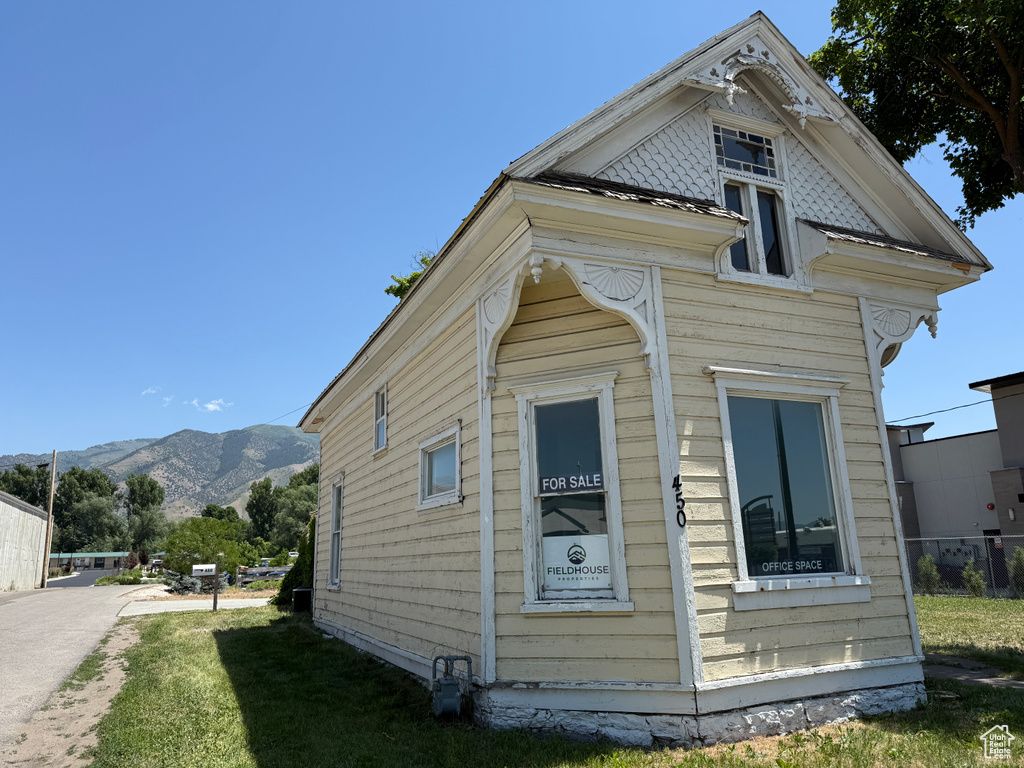 View of side of property featuring a mountain view
