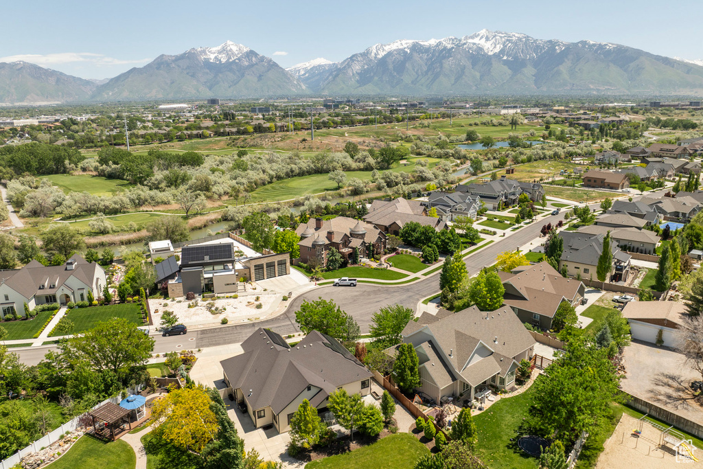 Aerial perspective of suburban area featuring a mountain backdrop