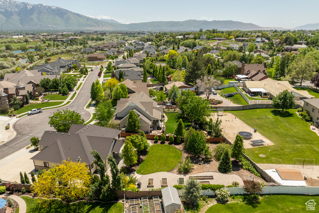 Aerial view of residential area featuring mountains