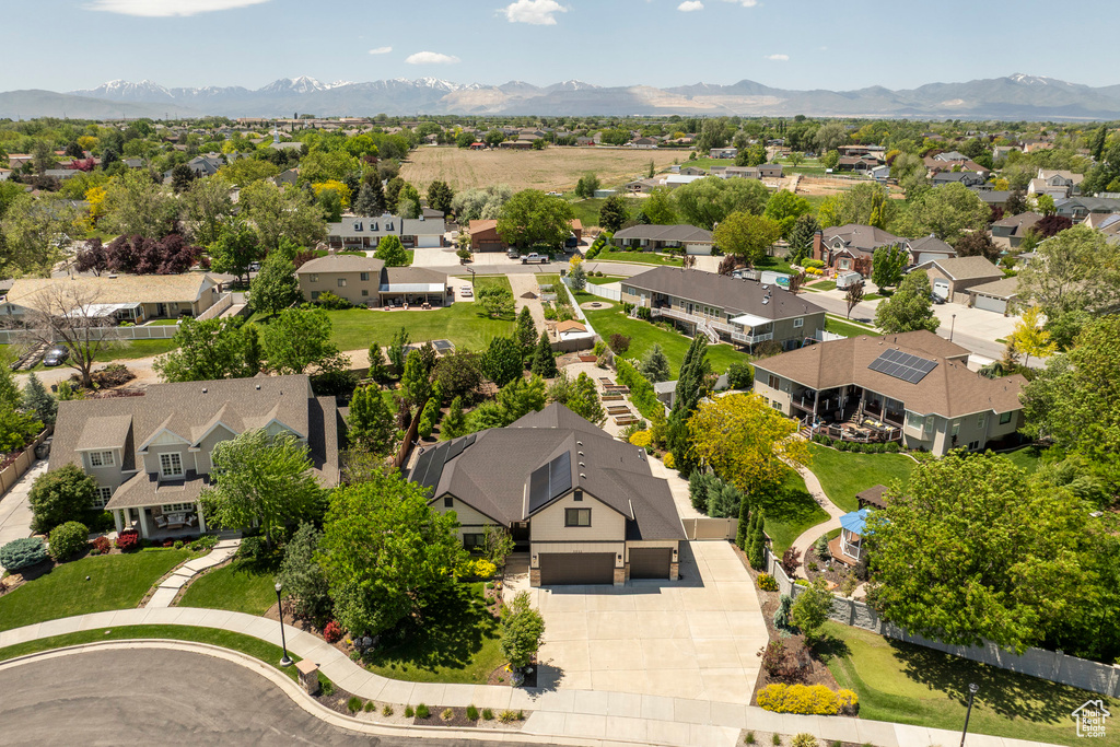 Aerial view of residential area featuring a mountain backdrop