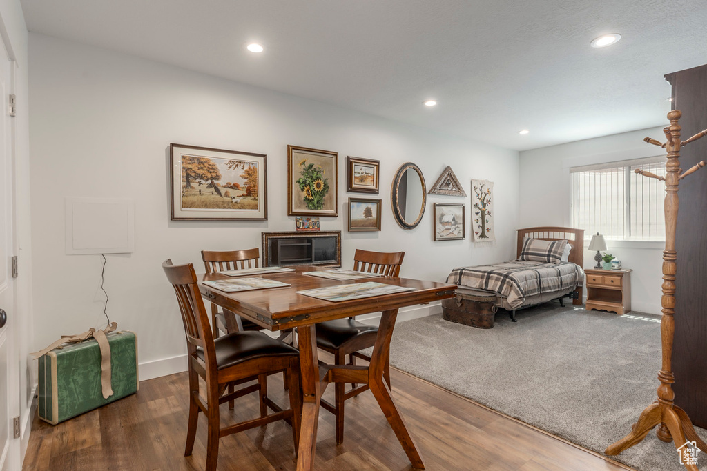 Dining space featuring wood finished floors and recessed lighting