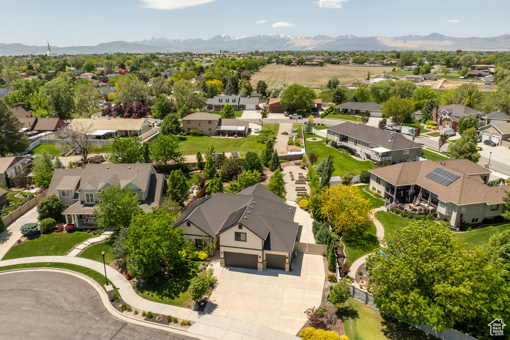 Aerial perspective of suburban area with a mountain backdrop