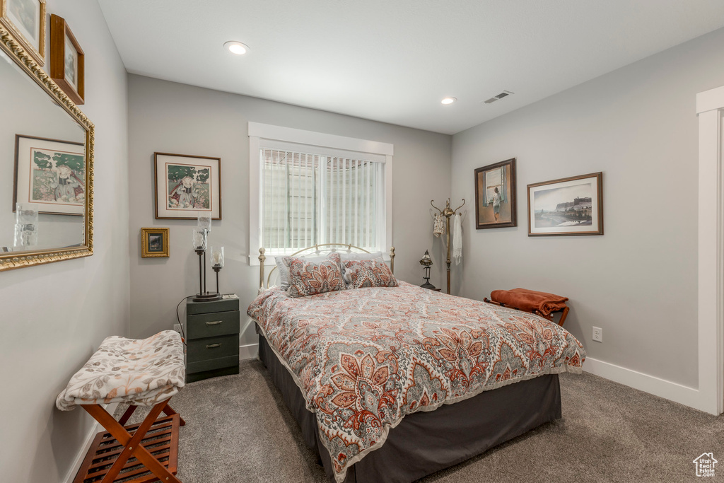 Carpeted bedroom featuring baseboards and recessed lighting