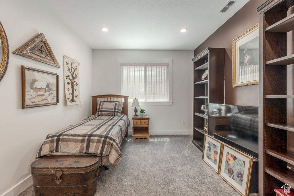 Bedroom with carpet floors and recessed lighting
