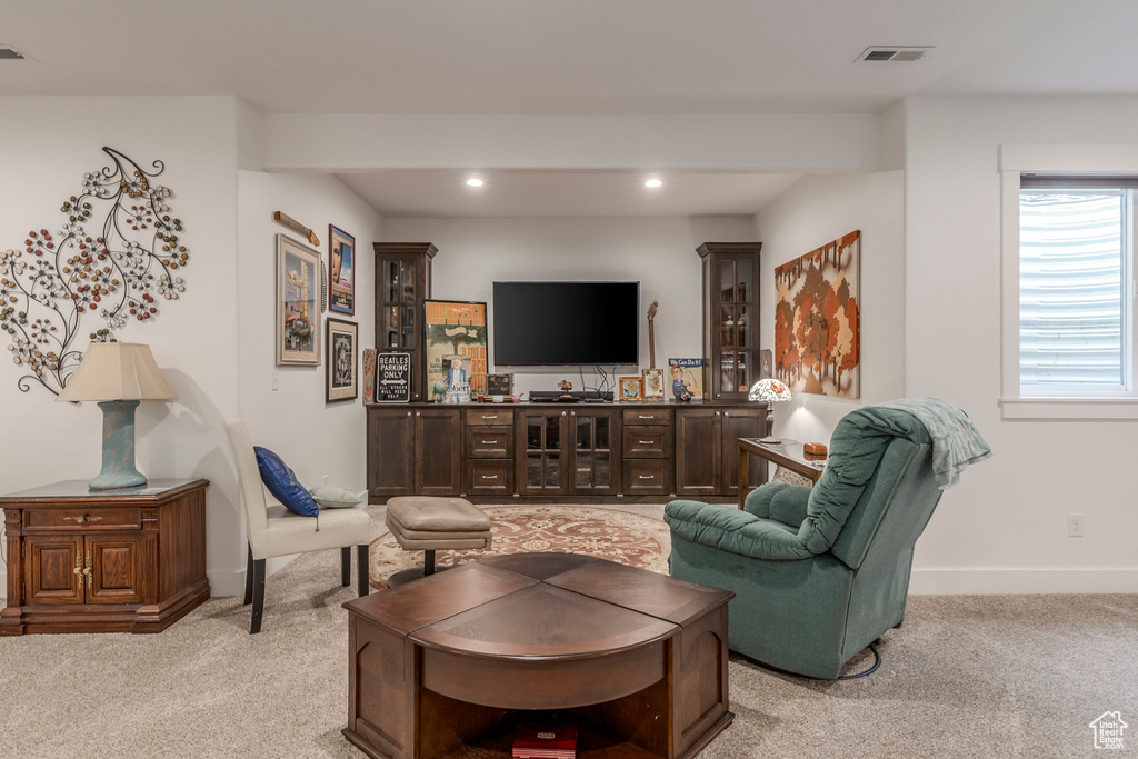Living room featuring light carpet and recessed lighting