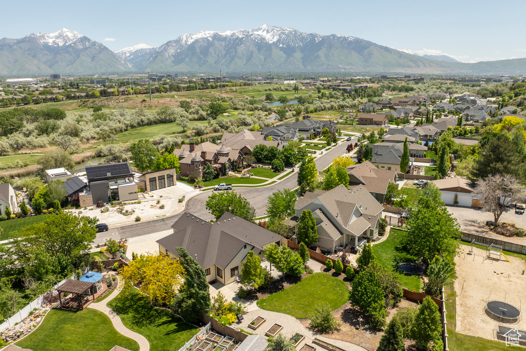 Aerial perspective of suburban area with a mountainous background