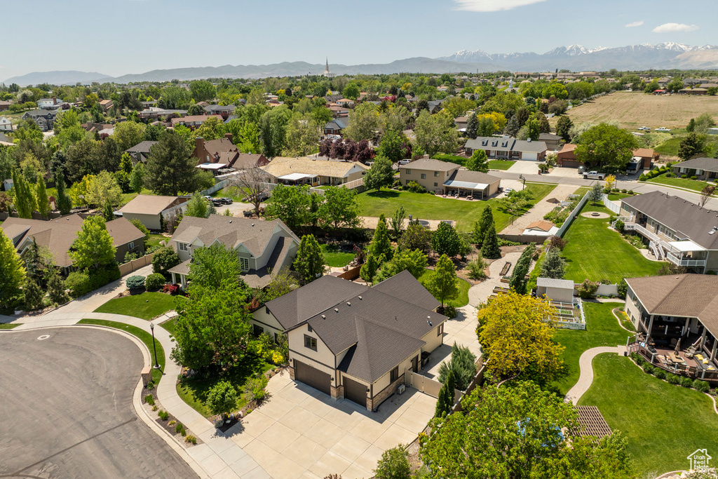 Aerial view of residential area featuring a mountainous background