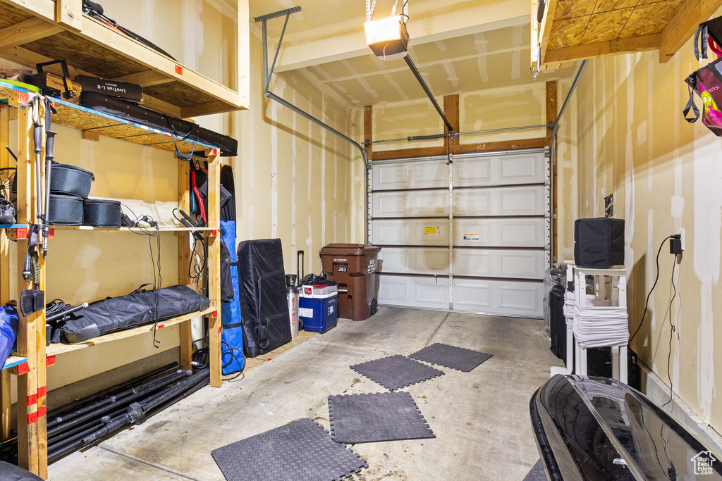 Garage featuring a garage door opener
