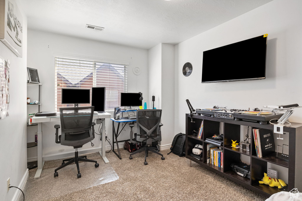 Carpeted office with baseboards