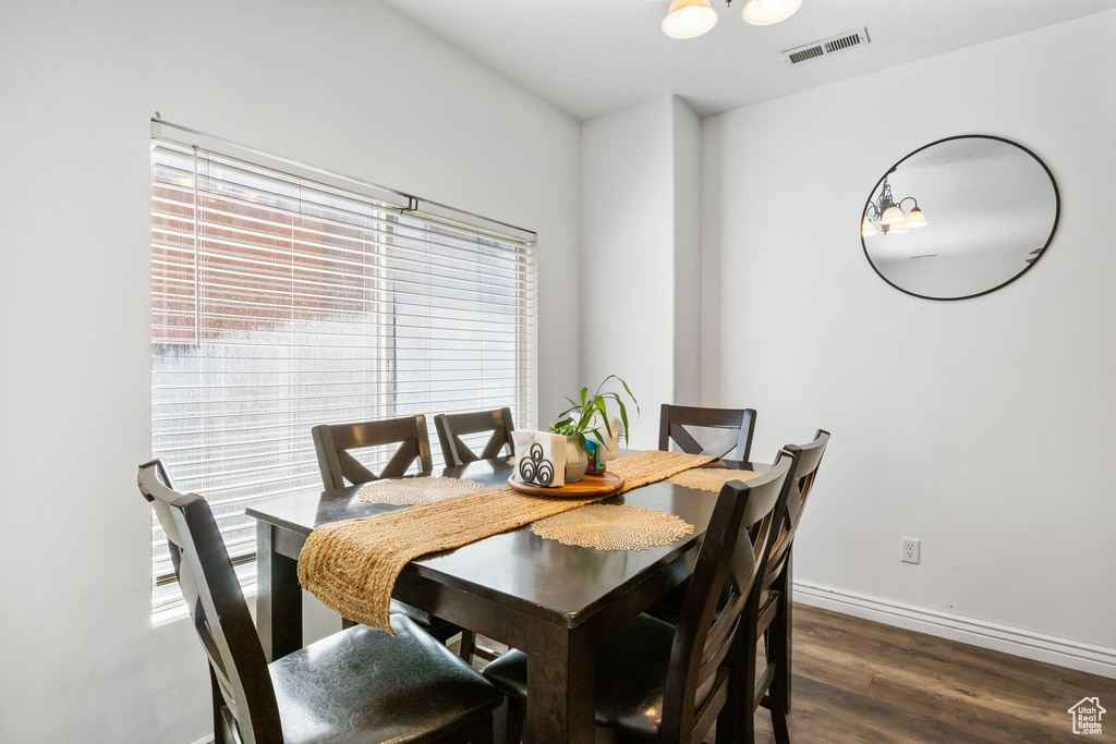 Dining area featuring wood finished floors and baseboards