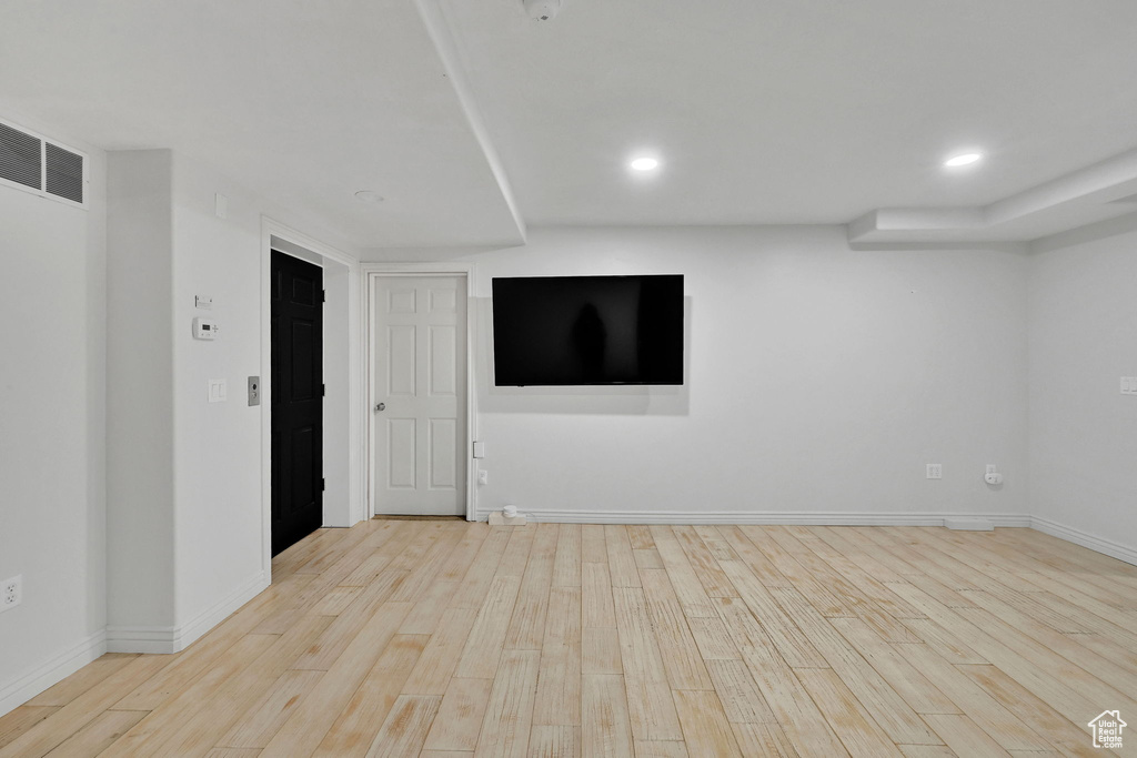 Spare room featuring wood finished floors and recessed lighting