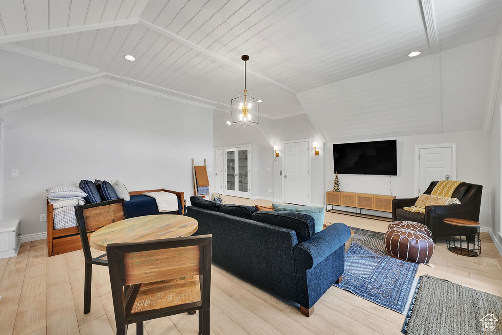 Living area featuring vaulted ceiling, light wood-style flooring, recessed lighting, and wood ceiling
