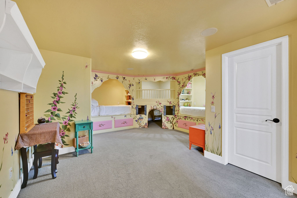 Recreation room with carpet and baseboards