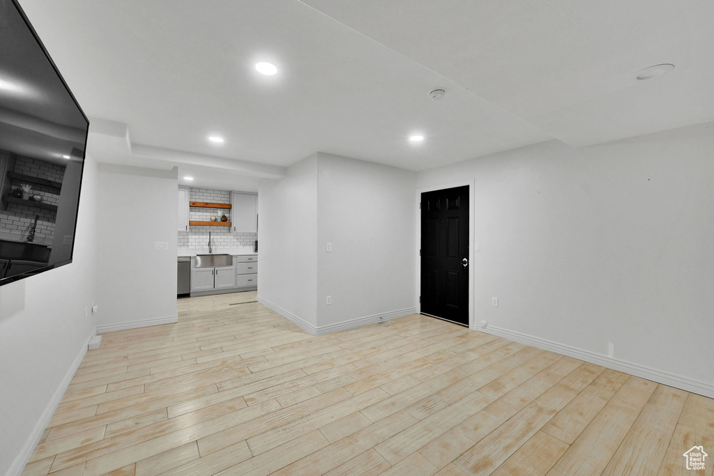 Unfurnished living room with recessed lighting and light wood-style floors