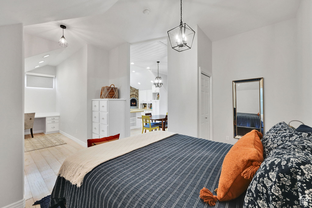 Bedroom featuring a chandelier, recessed lighting, and high vaulted ceiling