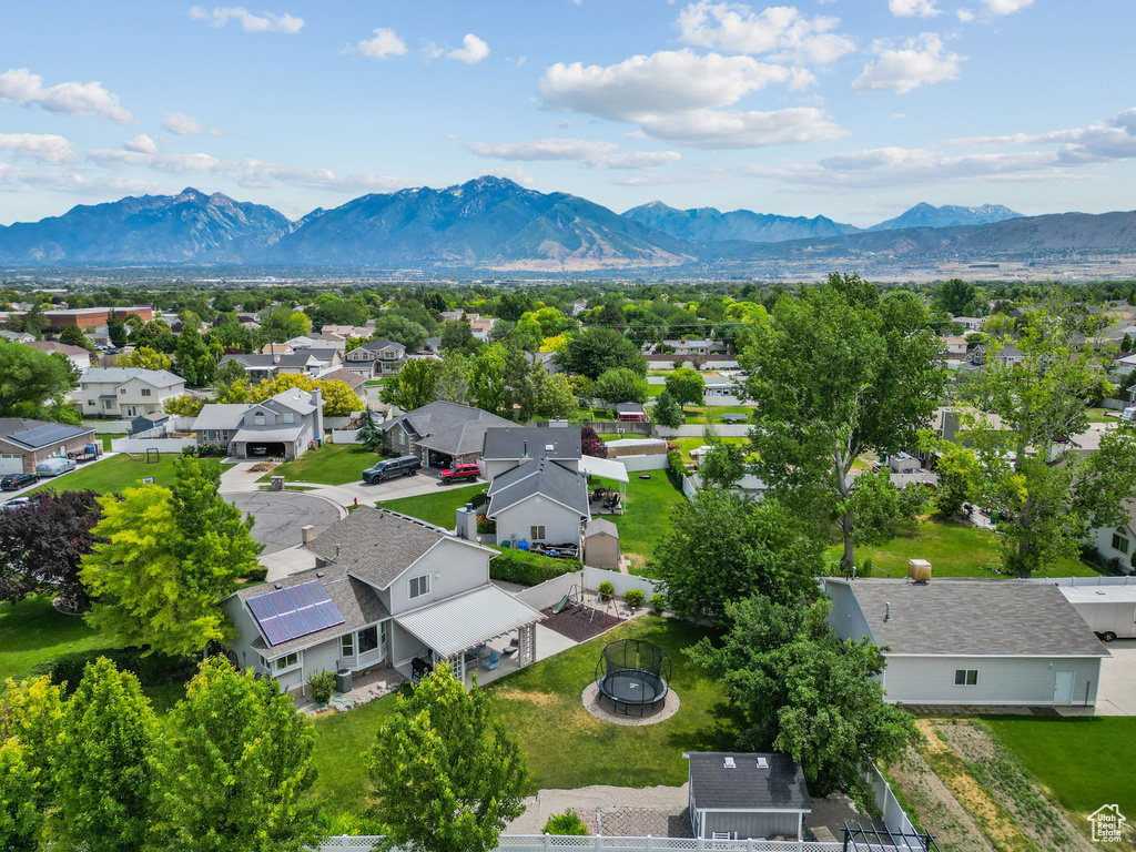 Aerial perspective of suburban area with a mountain backdrop