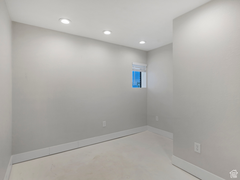 Spare room featuring concrete flooring and recessed lighting