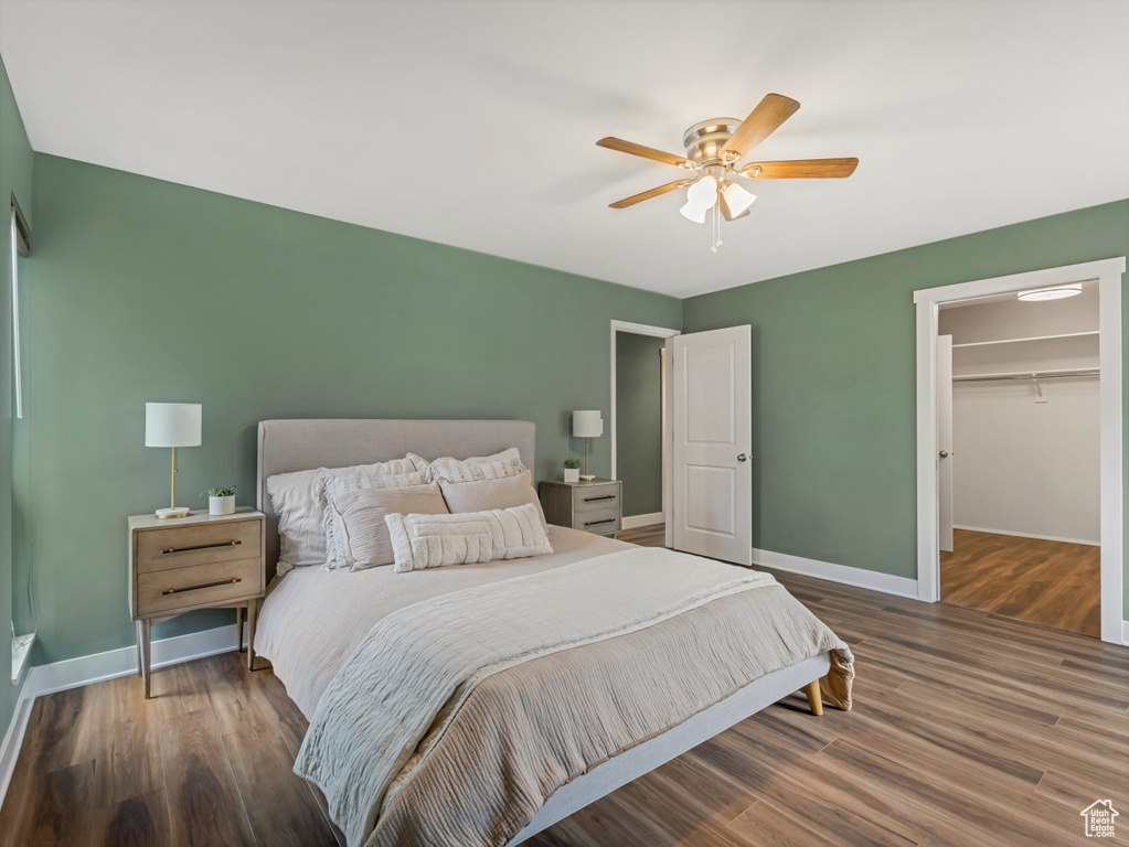 Bedroom featuring wood finished floors and a ceiling fan