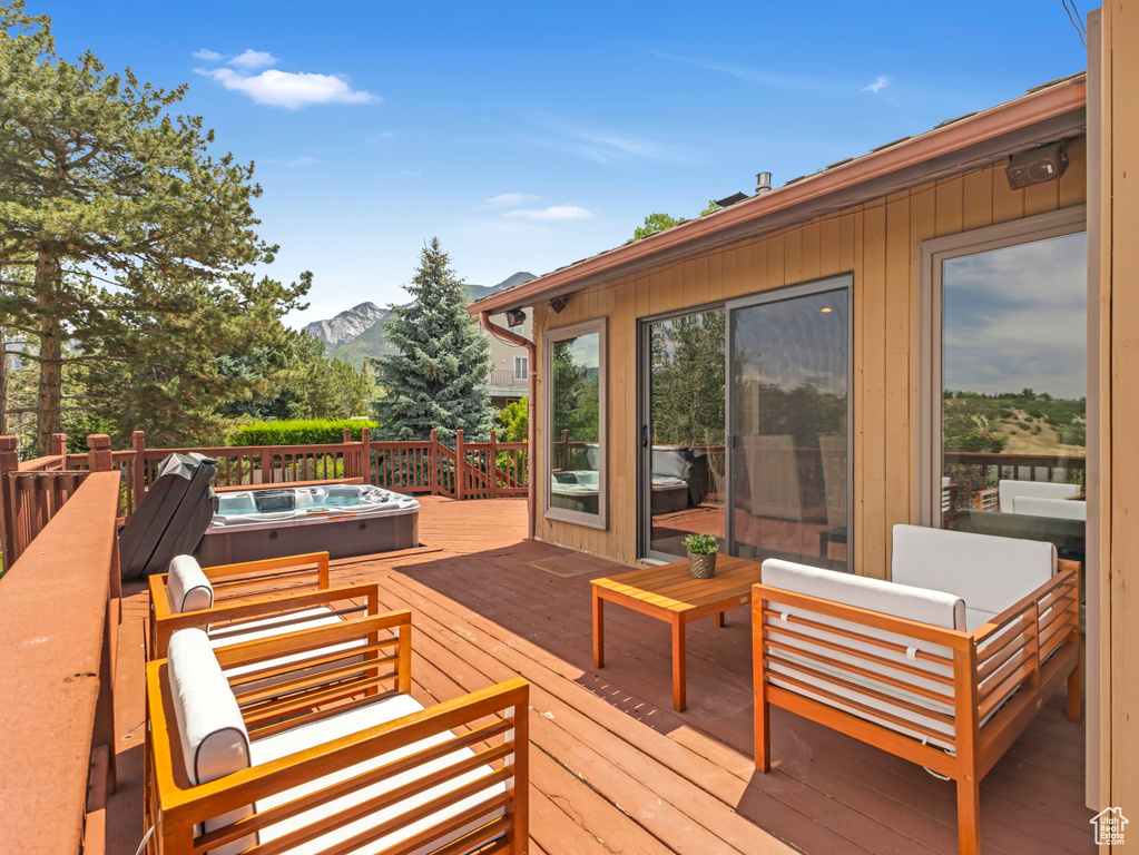 Wooden terrace with a mountain view and outdoor lounge area