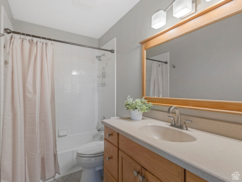 Bathroom with vanity and shower / bath combo