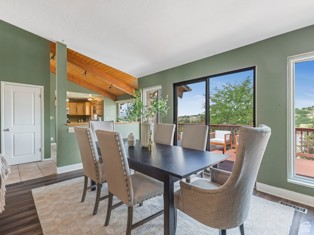 Dining room with healthy amount of natural light and light wood-style floors