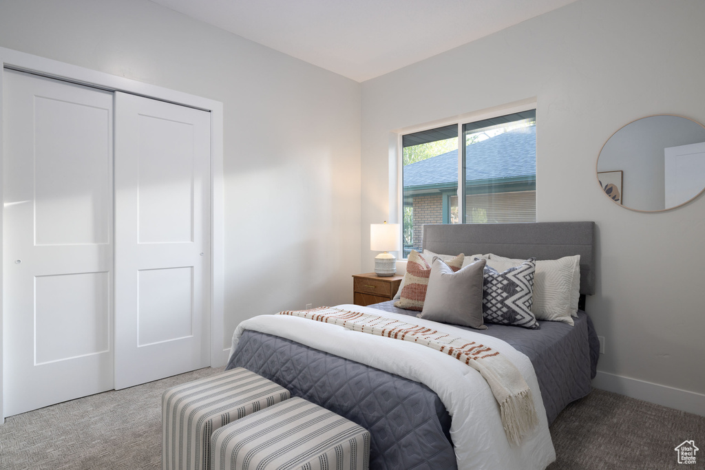 Bedroom featuring carpet floors and a closet
