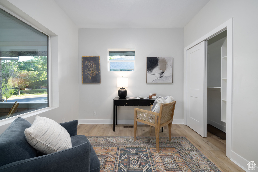 Home office with wood finished floors and baseboards