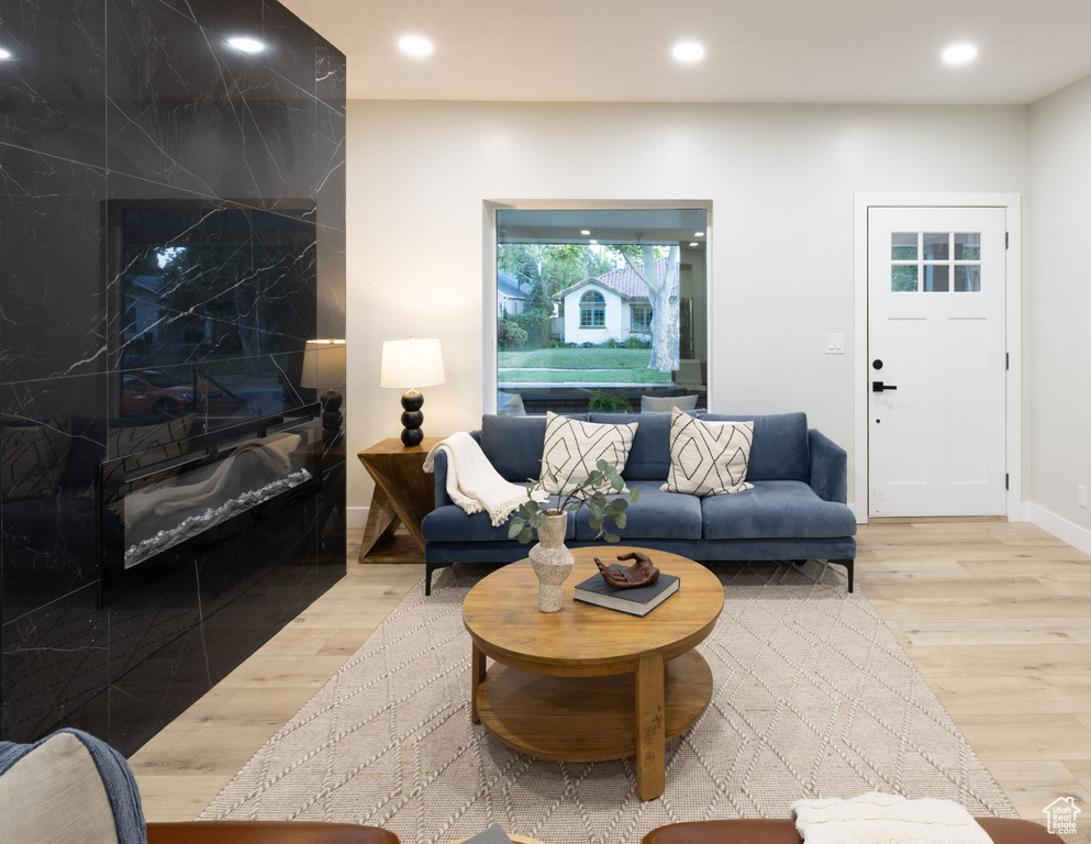 Living area featuring wood finished floors and recessed lighting