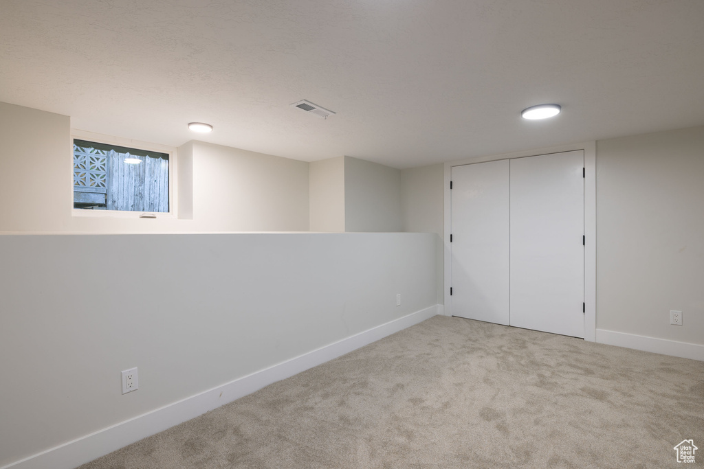 Finished below grade area with carpet floors and baseboards