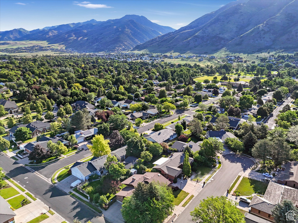Aerial view of residential area featuring a mountain backdrop