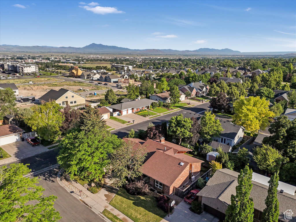 Aerial perspective of suburban area with a mountain backdrop