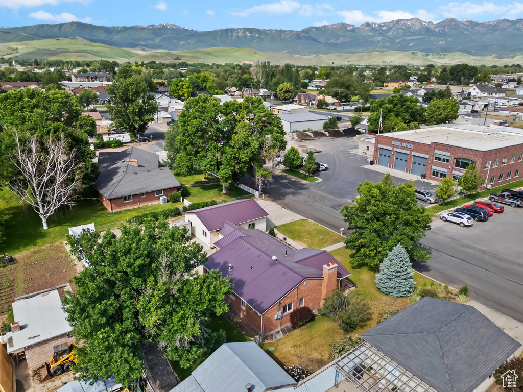 Aerial view of residential area featuring a mountain backdrop