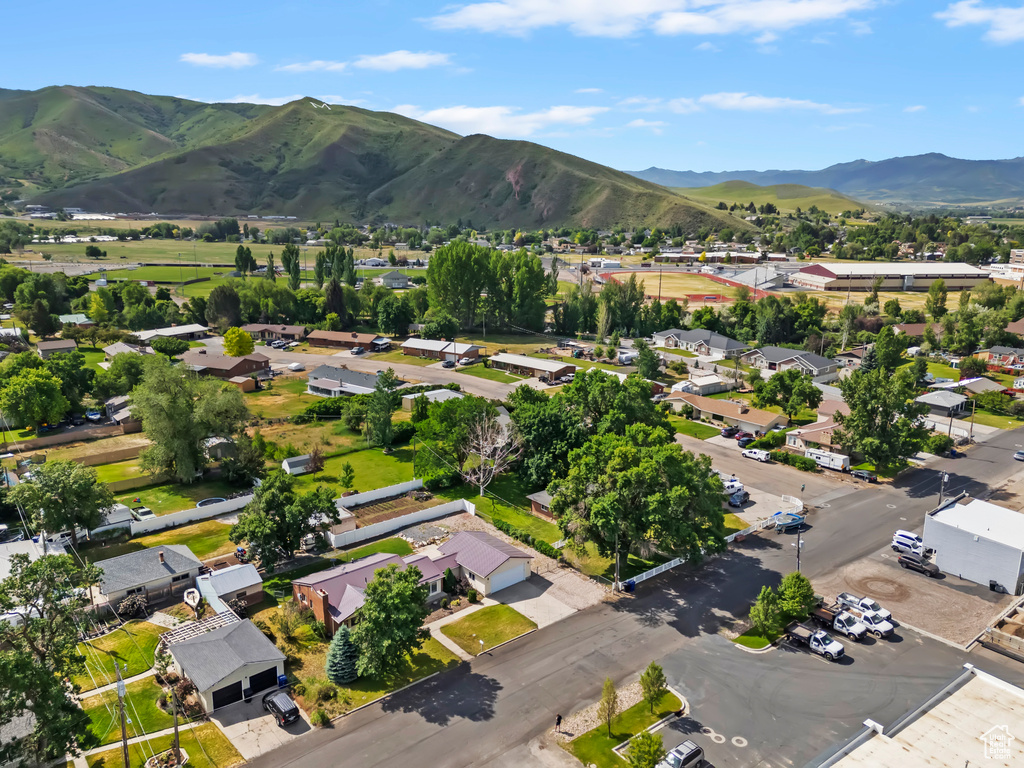 Aerial view of property\\\'s location featuring mountains and nearby suburban area