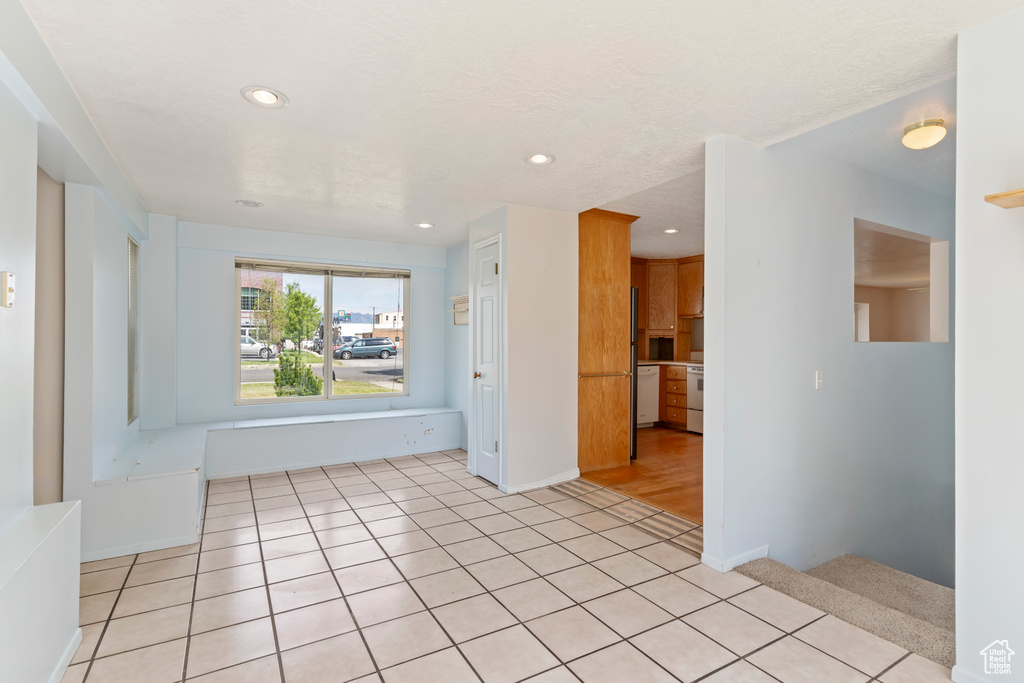 Spare room featuring recessed lighting and light tile patterned floors