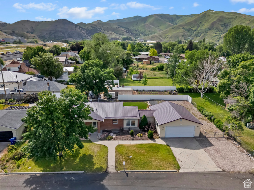 Aerial perspective of suburban area with a mountainous background