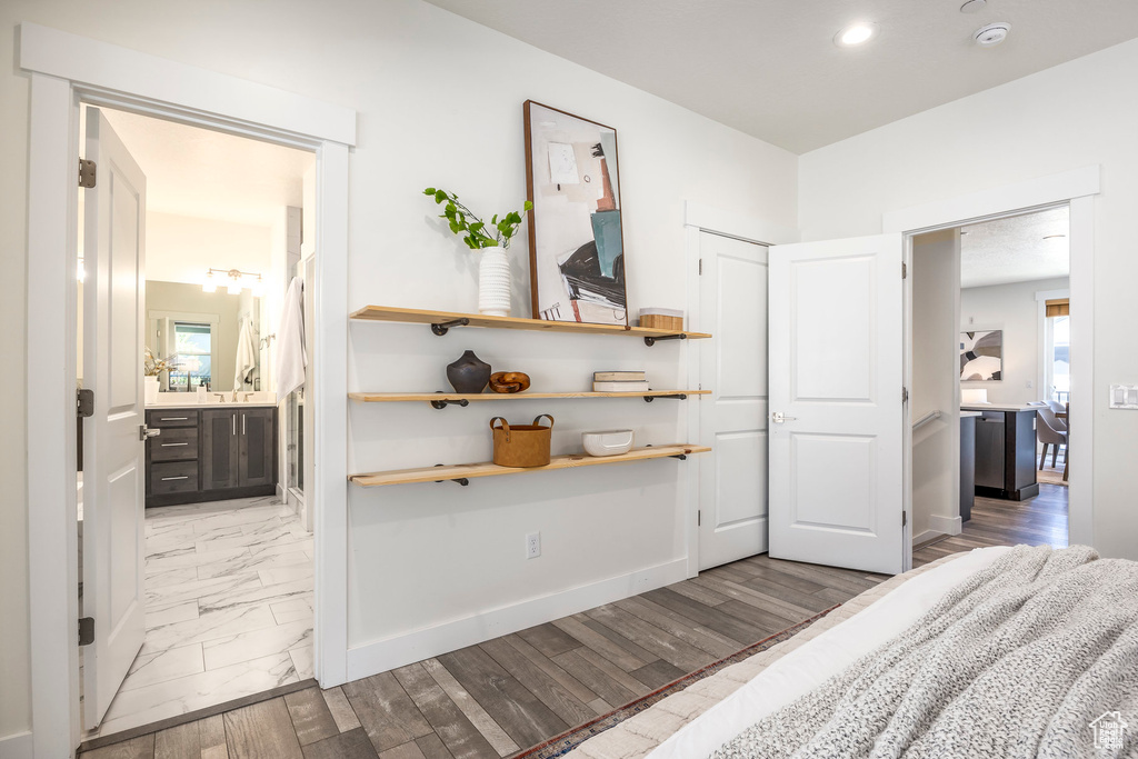 Unfurnished bedroom with recessed lighting and connected bathroom