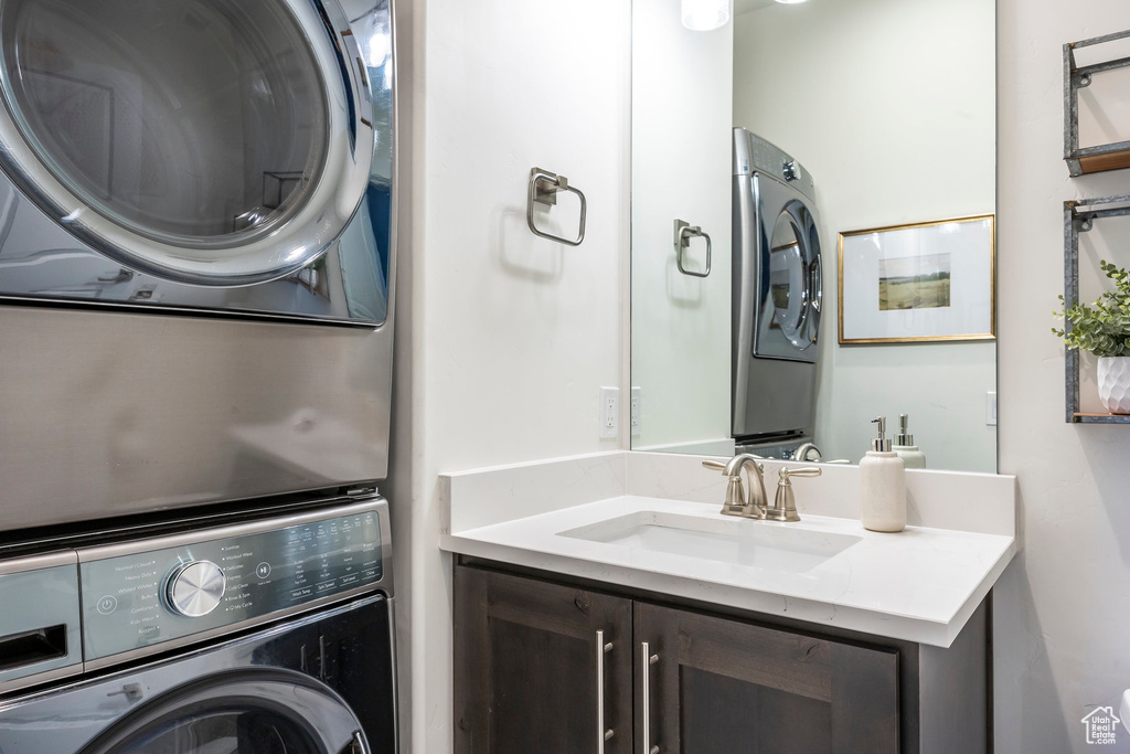 Laundry area with stacked washer / drying machine