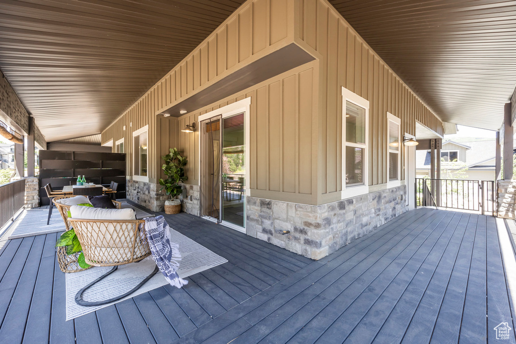 Wooden terrace featuring an outdoor living space