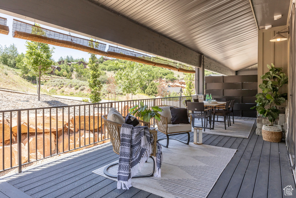Wooden terrace with outdoor dining space