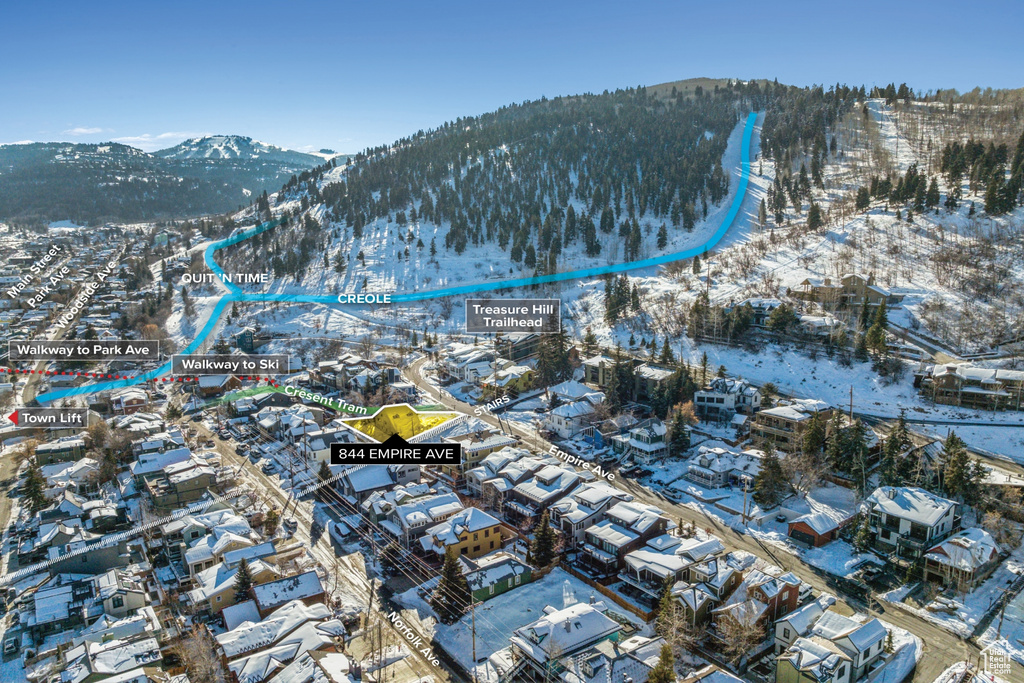 Snowy aerial view featuring a mountain view