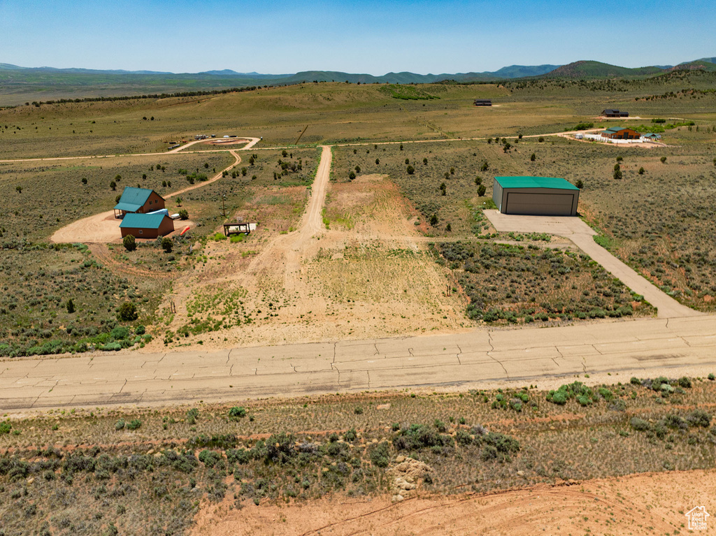 Aerial view of sparsely populated area with a mountainous background