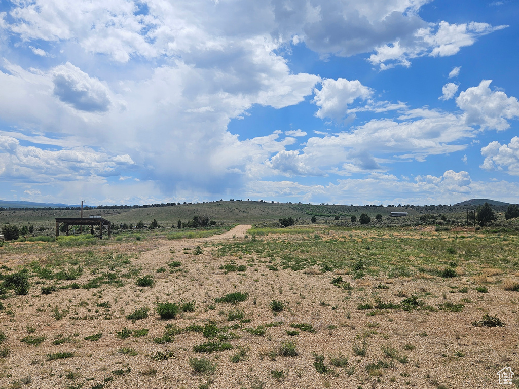 View of yard with a rural view