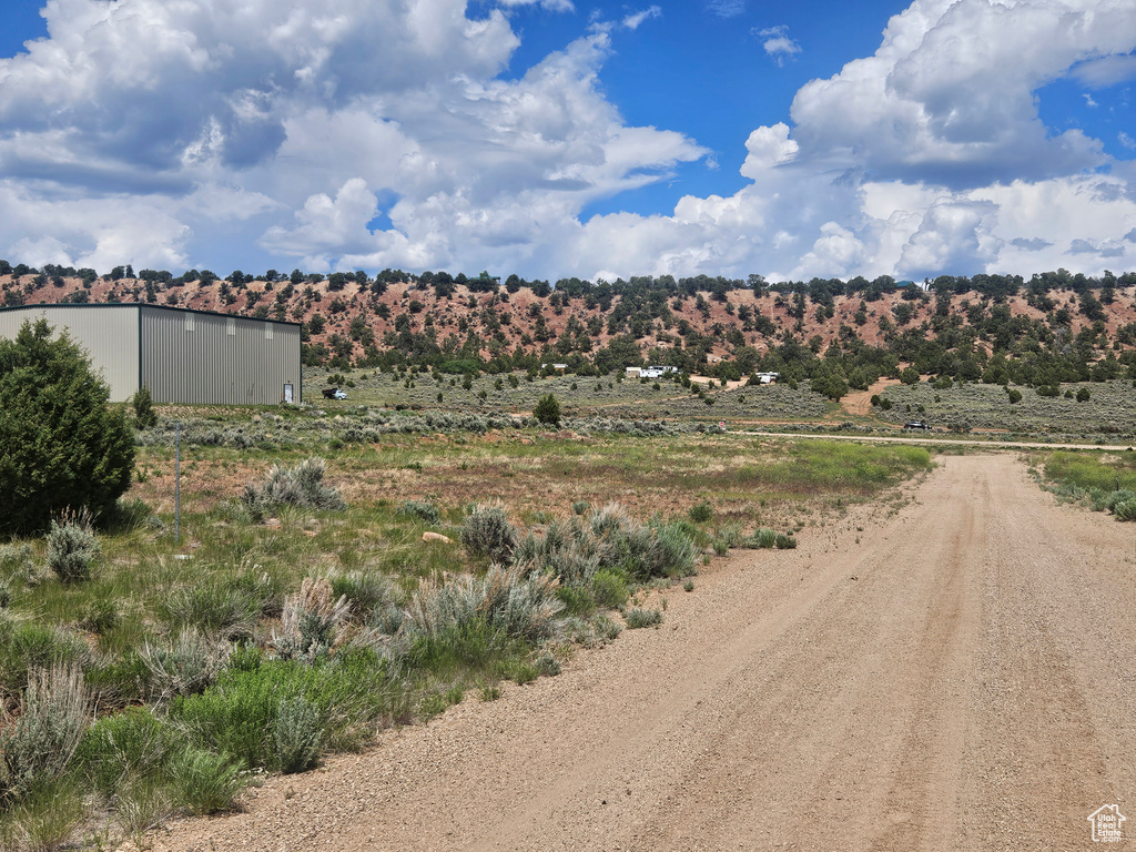 View of mountain background featuring rural landscape
