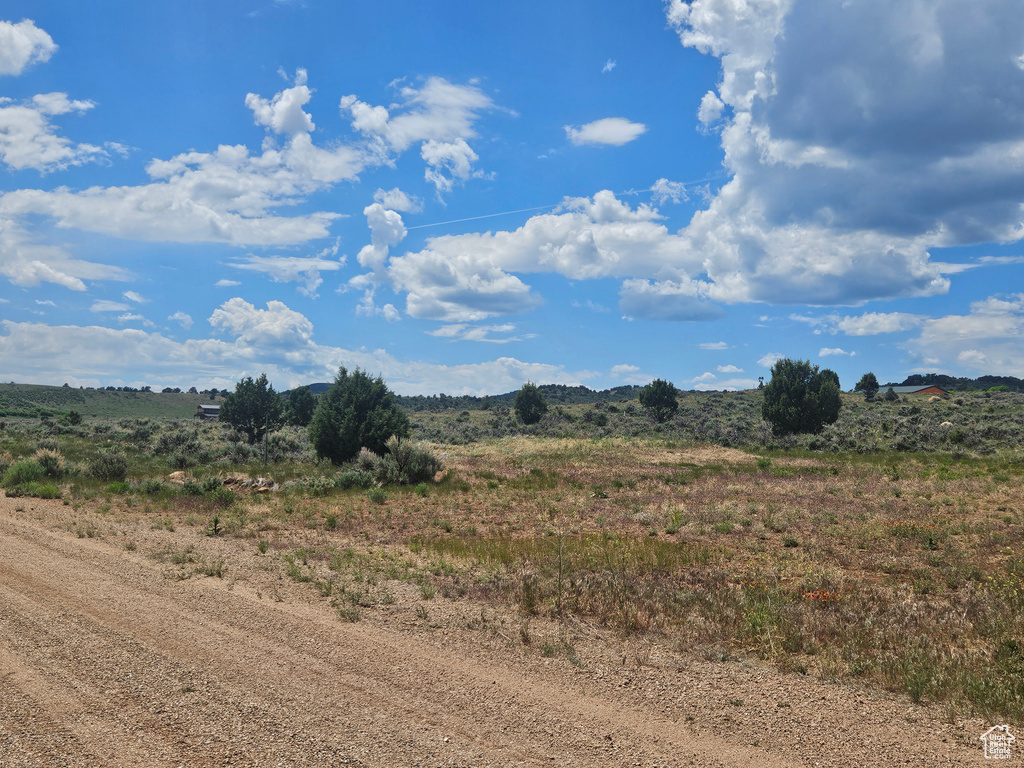 View of mountain background featuring rural landscape
