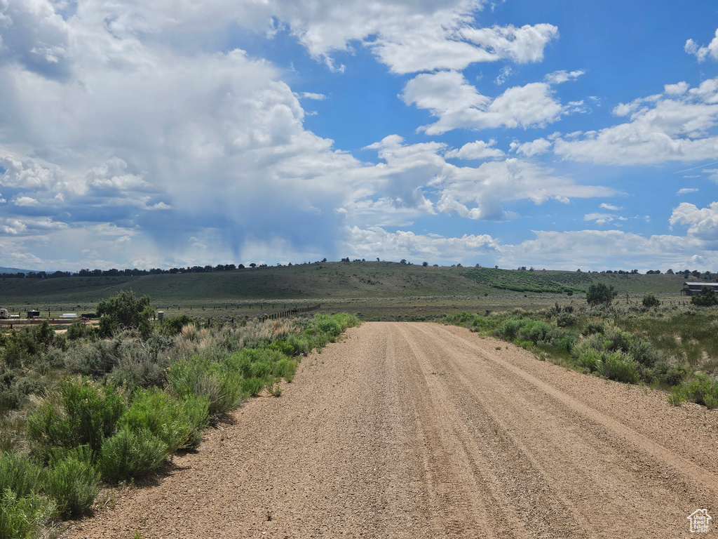View of dirt / gravel road featuring a rural view